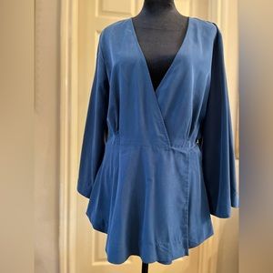 Free People blue top with wrap around skinny tie belt.